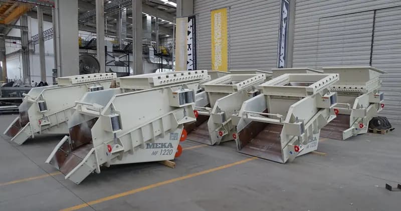 Industrial machines lined up in a factory hall