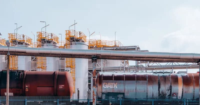 Industrial plant with pipes, tanks and tank wagons