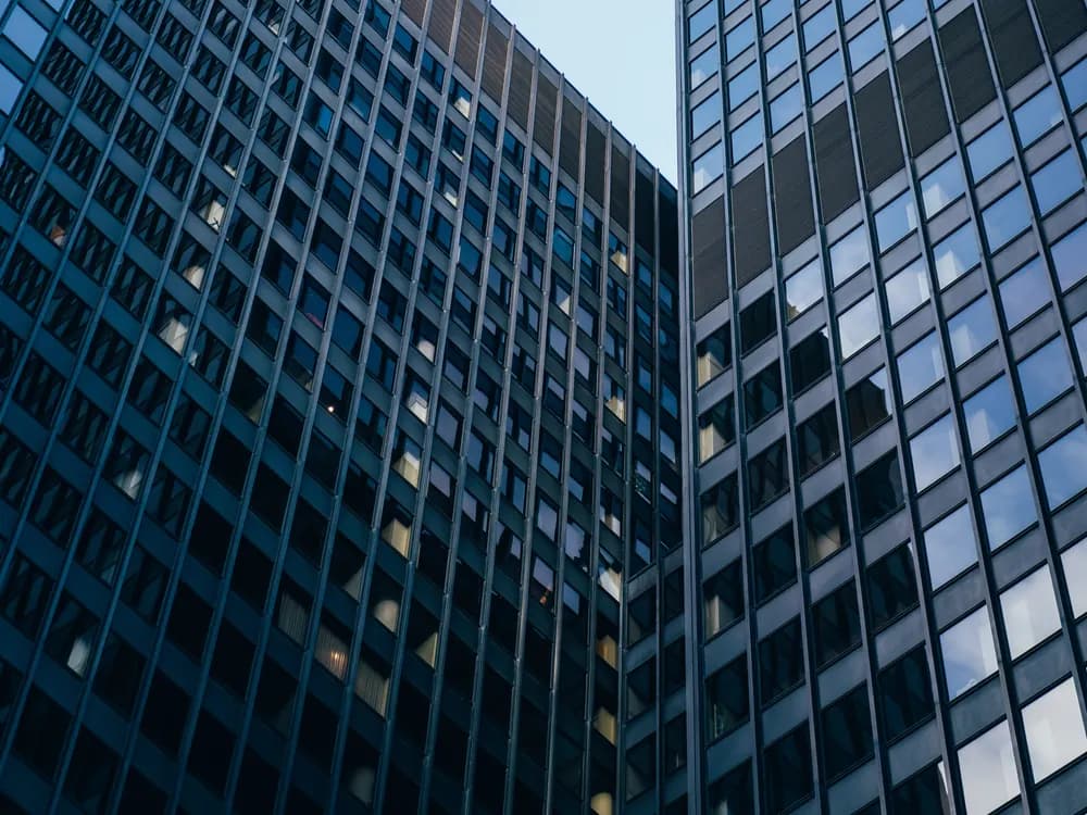 Glass-fronted office towers seen at an angle